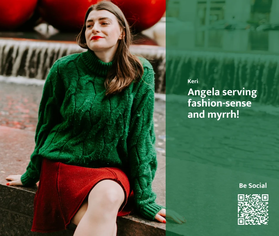 Woman in a green sweater and red skirt sits by a fountain, with text overlay reading “Angela serving fashion-sense and myrrh!”